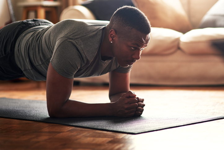 man doing planks at home